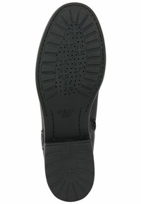 Suela de goma negra con patrón de textura antideslizante y orificios de drenaje, con la marca Geox. Punta redondeada y bordes reforzados para mayor durabilidad.