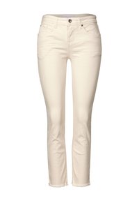 Ljusbeige jeans i bomullsblandat tyg, med smal passform, femficksdesign, subtilt fransad fåll och framknäppning.