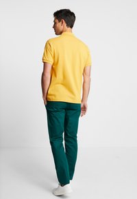 Lacoste Piké - darjali