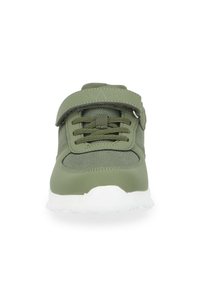 Green athletic shoe with a mesh upper, strap closure, and lace front. Features a white cushioned sole, designed for comfort and support.