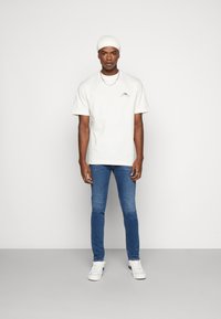 Diesel SLEENKER - Calças de ganga de corte skinny - 09d44 01
