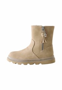 Beige mockasonsstövlar med sidodragkedja, stjärnformad dragkedjeöppnare, sömnadsdetaljer och tjock sula med kanter.