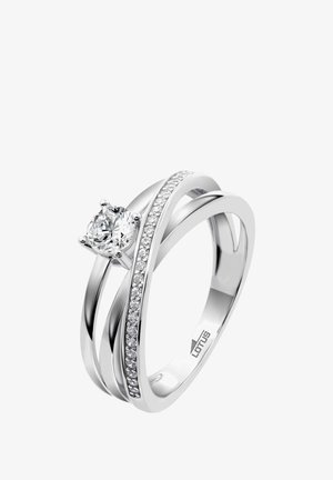 Silver ring featuring a central round diamond, with an intertwined band and a side row of smaller diamonds for added detail.