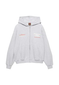 Világosszürke cipzáras kapucnis pul�óver elülső zsebekkel, bal mellrészen Toyota Land Cruiser logóval, jobb mellrészen "Driving All Roads in Style" felirattal.