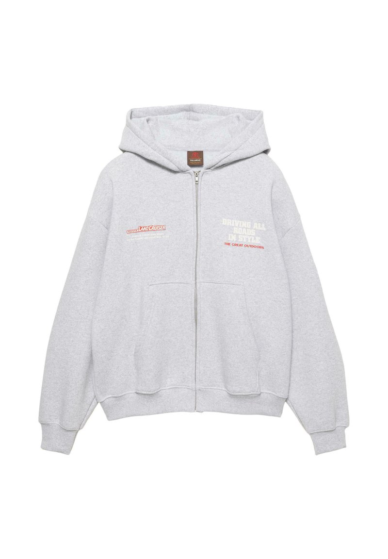 Világosszürke cipzáras kapucnis pulóver elülső zsebekkel, bal mellrészen Toyota Land Cruiser logóval, jobb mellrészen "Driving All Roads in Style" felirattal.