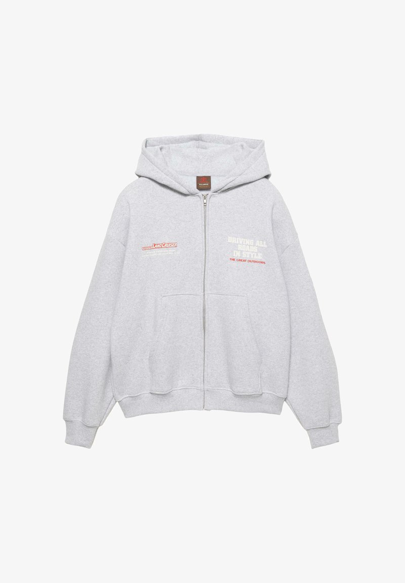 Felpa con cappuccio grigio chiaro con cerniera, tasche anteriori, logo Toyota Land Cruiser sul petto a sinistra e testo "Driving All Roads in Style" sul petto a destra.