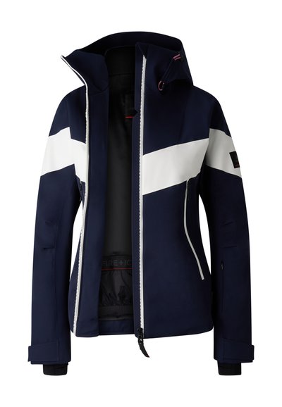 Marynarkowy granatowy płaszcz z białymi panelami, wysokim kołnierzem, zamkiem błyskawicznym z przodu, bocznymi kieszeniami oraz regulowanymi mankietami. Wykonany z wodoodpornego materiału.