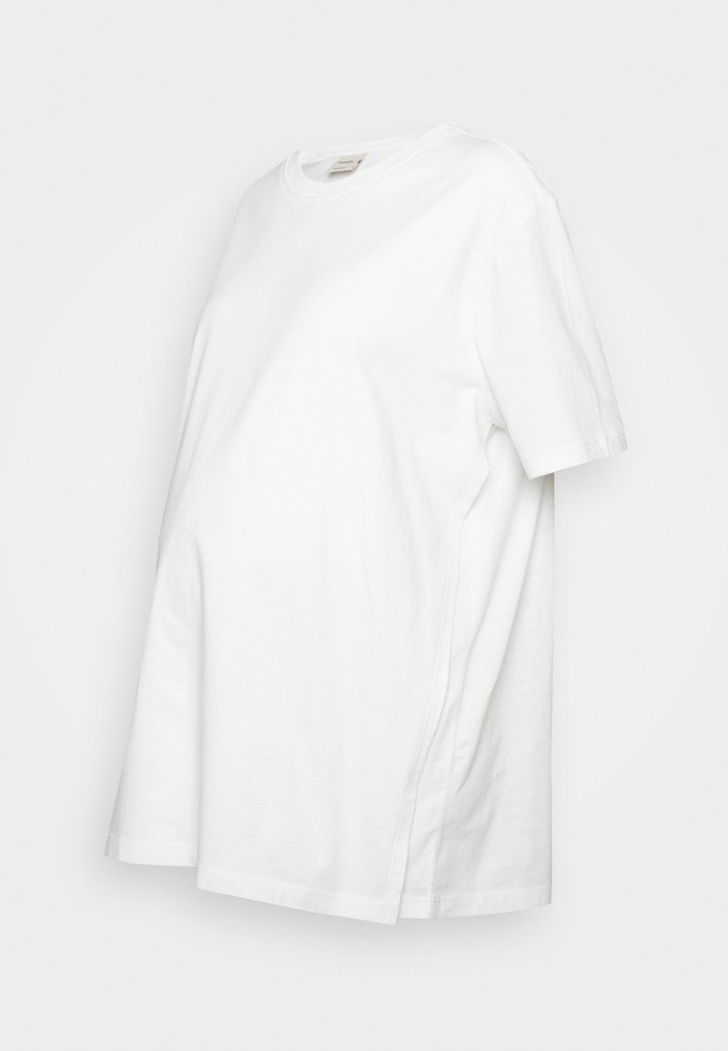 T-shirt de maternidade em algodão branco, mangas curtas, corte solto, detalhes nas costuras laterais, decote redondo, textura suave, comprimento médio.