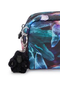 Floral-patterned pouch in vibrant colors with a textured fabric, featuring a black fluffy gorilla keychain accent. Zipper closure detail visible.