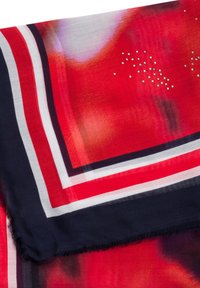 Red and navy patterned scarf featuring a gradient design, with white and black stripes and scattered rhinestone accents. Soft texture.