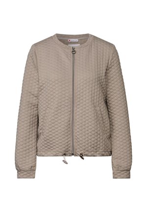 Veste bomber beige matelassée avec un col rond, une fermeture éclair à l'avant, des poignets élastiques et une taille à cordon. Présente une texture en forme de losange.