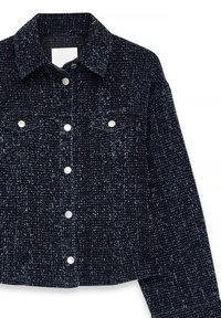 Navy blue textured jacket made from woven fabric, featuring silver buttons, two chest pockets, and a pointed collar.