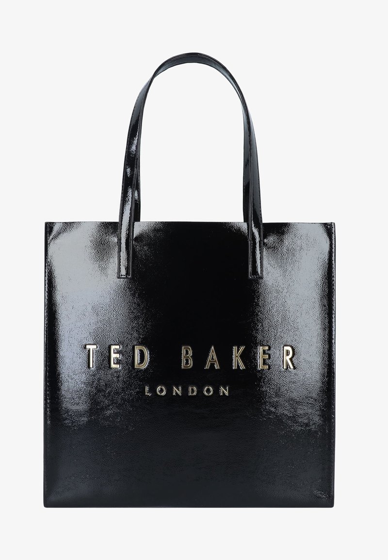 Sac cabas noir brillant Ted Baker London avec deux anses et le nom de la marque embossé en or centré sur le devant.