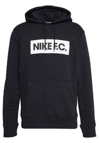 Sweat à capuche noir en tissu doux avec une poche kangourou. Logo blanc "NIKE F.C." sur la poitrine. Poignets et ourlet côtelés.