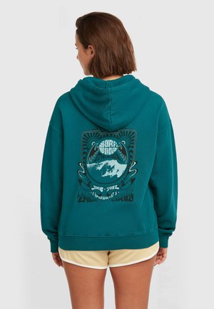 Tyrkashoodie met een grafisch ontwerp van bergen en golven op de achterkant, geribbelde boorden en een capuchon met trekkoord. Zachte stoftextuur.