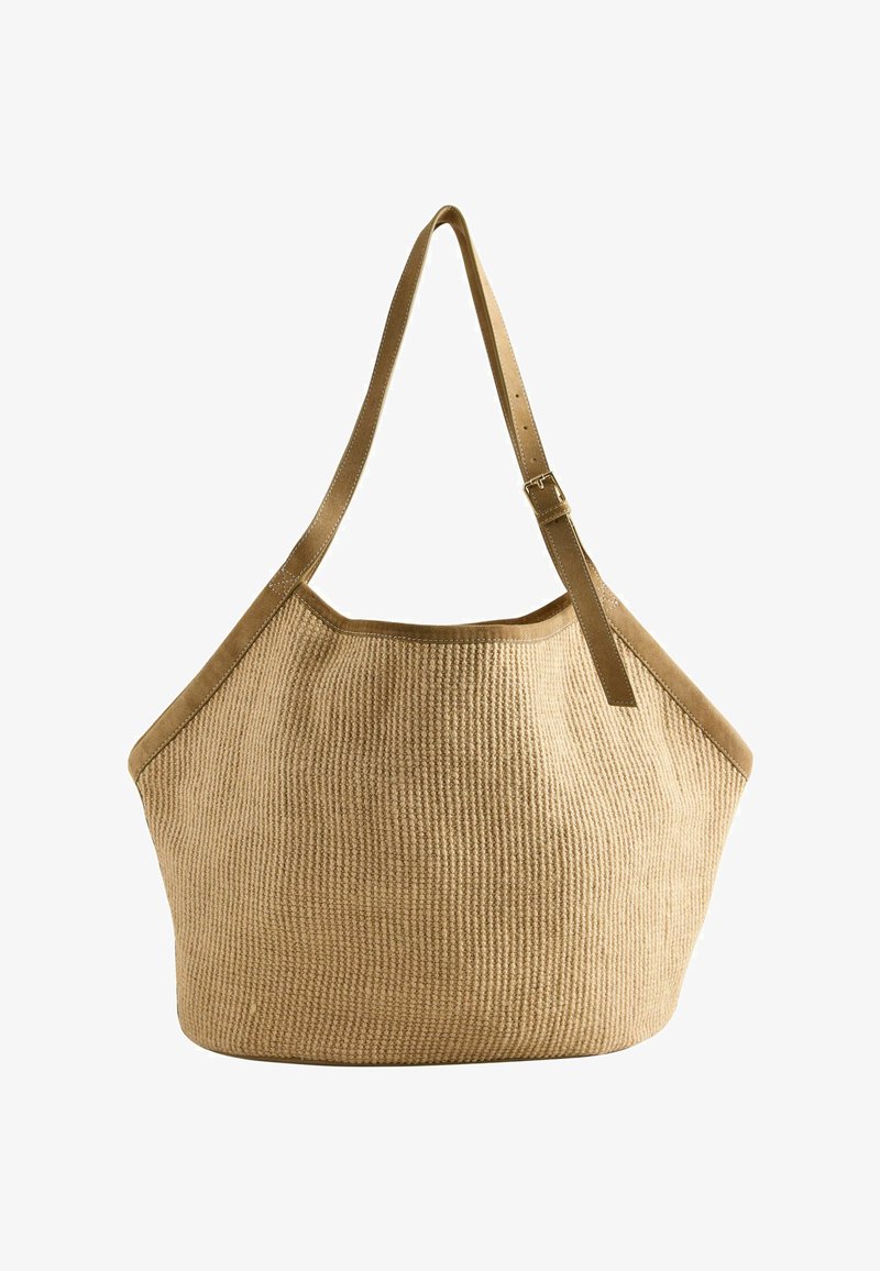Geantă tote bej cu textură, având o curea reglabilă din piele maro și margini, formă lată rotunjită și bază structurată.