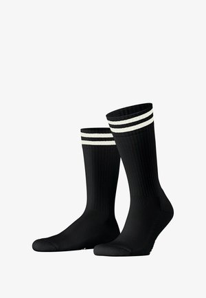 Black ribbed socks featuring two white stripes at the top. Smooth texture and standard ankle length with reinforced toe and heel areas.