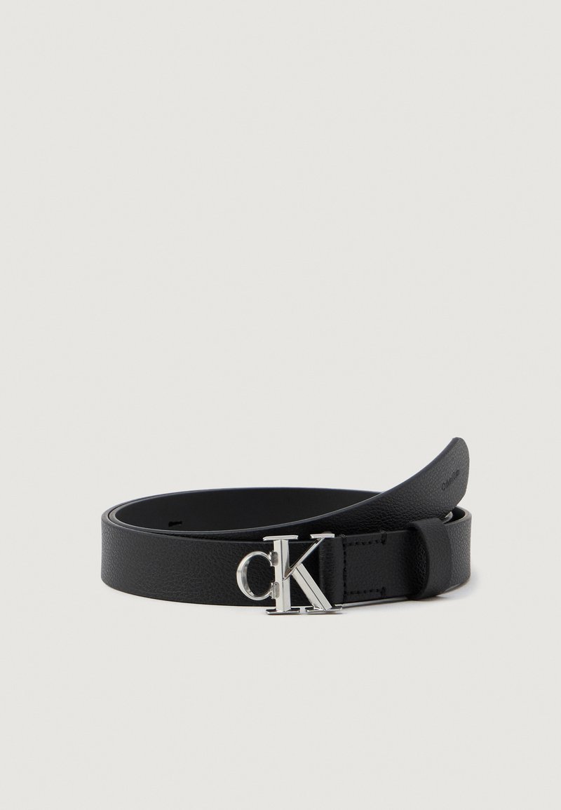 Black leather belt featuring a smooth texture, a silver "CK" logo buckle, and a simple design. The belt tapers toward the end.