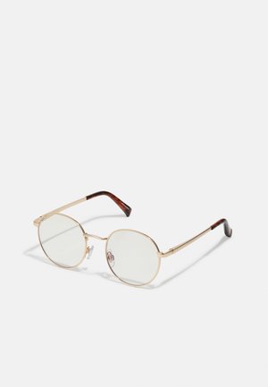 Óculos de armação oval em metal dourado com lentes transparentes. Acentos em tartaruga nas hastes. Almofadas ajustáveis no nariz para conforto.