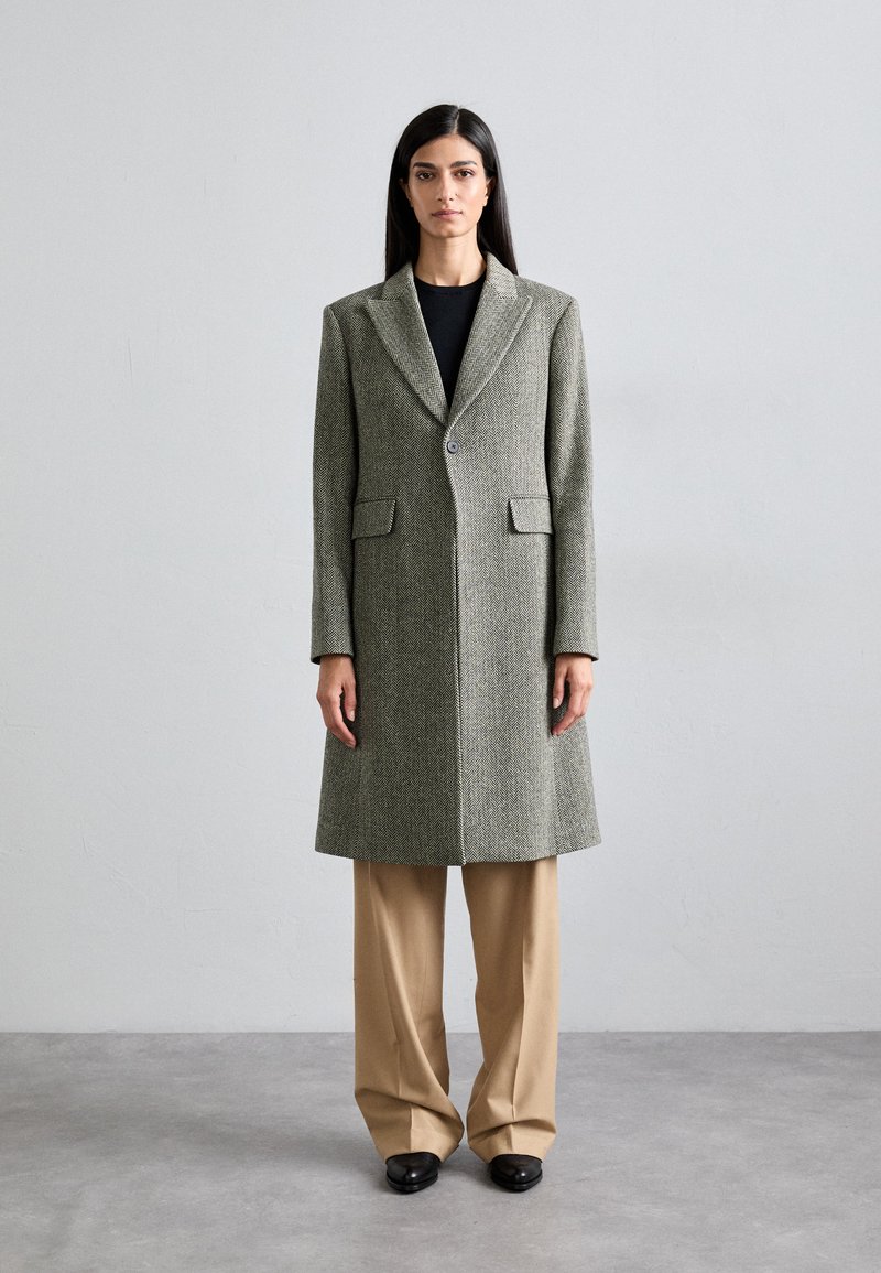 Wool blend coat in herringbone pattern, light grey and dark green, with a single button closure, notch lapel, and two front pockets.