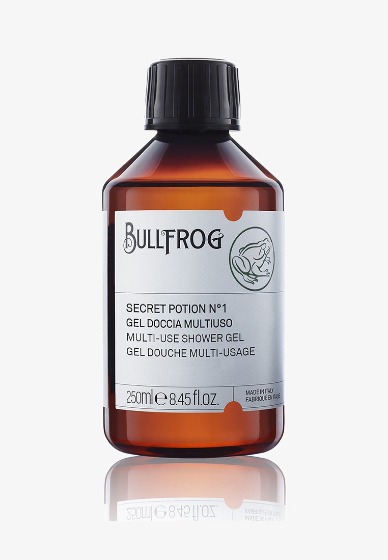 Bottiglia in vetro ambrato con tappo nero. L'etichetta presenta un'icona di rana, il nome del prodotto "Secret Potion N°1" e un testo multilingue. Capacità di 250 ml.