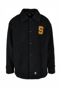 Jachetă din fleece neagră cu închidere cu butoane, guler ascuțit și logo galben "S" pe partea stângă a pieptului. Textură moale și croială confortabilă.