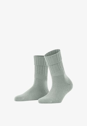 Chaussettes grises claires côtelées avec un revers et une finition douce et texturée. Conçues pour le confort et la chaleur, avec une coupe ajustée.