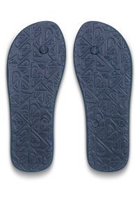Plantillas de zapatos de goma azul marino con un patrón de superficie texturizada que presenta diseños triangulares y marcas circulares para ofrecer agarre y soporte.