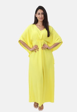 Abito kaftano giallo realizzato in tessuto leggero, con scollatura a V, maniche ampie e vita elastica, che crea una silhouette fluida.