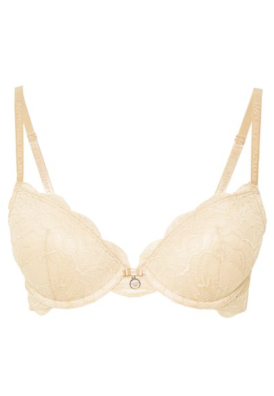 Beige lace bra with scalloped edges, underwire support, and subtle floral pattern. Features a small bow and decorative hardware at the center.