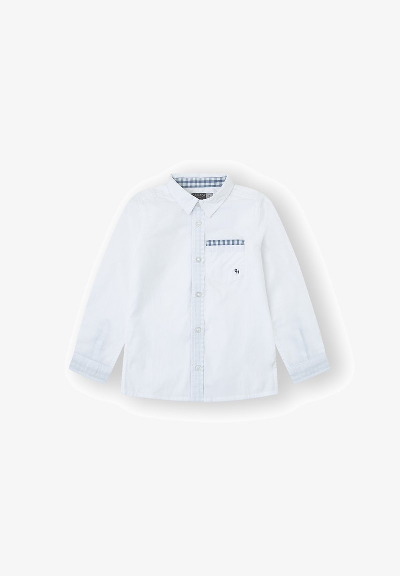 Camisa blanca de manga larga con botones en la parte delantera, bolsillo en el pecho con patrón a cuadros y cuello clásico. Fabricada con una mezcla de algodón ligero.