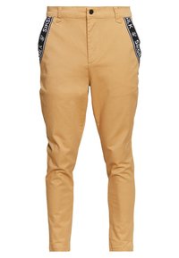 Pantaloni beige in cotone misto, con strisce laterali nere e lettere bianche. Vestibilità slim con chiusura tradizionale a bottoni e zip.