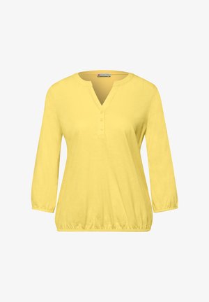 Geel damesblouse met lange mouwen, V-hals met drie knopen en elastische manchetten en zoom.