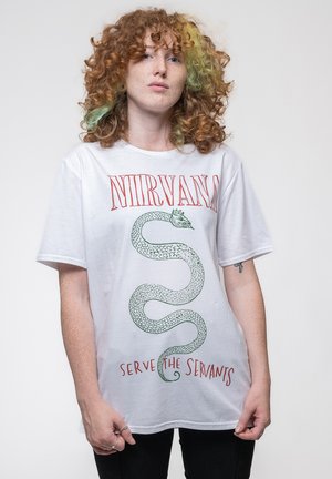 White cotton t-shirt with green snake graphic and red text "NIRVANA" and "SERVE THE SERVANTS," relaxed fit and short sleeves.