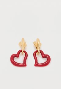 Κόκκινα σκουλαρίκια σε σχήμα καρδιάς με γυαλιστερό φινίρισμα, που διαθέτουν αγκίστρια σε χρυσό τόνο και κοίλο σχέδιο. Ελαφρύ και παιχνιδιάρικο στυλ.