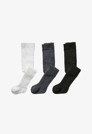 Four pairs of socks: one white smooth pair, one gray textured ribbed pair, and two dark gray and black smooth pairs, all mid-calf length.