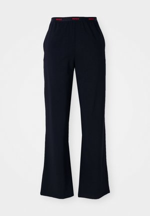 Melni kokvilnas plati bikses ar elastīgu jostu, ar sarkano "HUGO" logotipu. Gluda auduma; sānu kabatas ar brīvu piegriezumu.