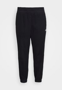 Black sweatpants made from soft fabric, featuring an elastic waistband, tapered ankles, and a small logo detail on the side.