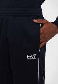 EA7 Emporio Armani PANTALONI - Träningsbyxor - blue