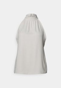 Blouse sans manches à col montant en tissu beige clair. Présente un design froncé au niveau de l'encolure et une fermeture éclair discrète au dos.