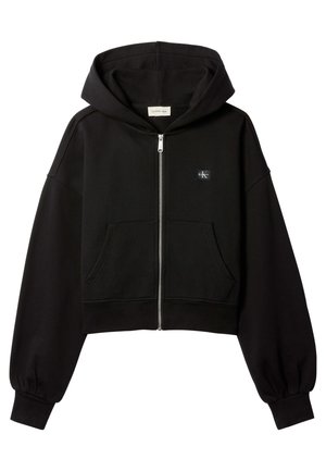 Must cropped lukuga dressipluus esi taskute, lõdva lõikega, elastsete mansettidega ja väikese Calvin Kleini logoga rinnal.