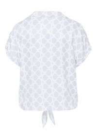 Witte top met korte mouwen en een subtiel circulair patroon. Heeft een losse fit en een knoopdetail op de rug. Gemaakt van lichtgewicht, ademend materiaal.