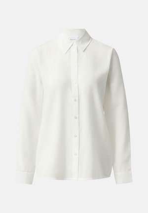 White long-sleeve button-up shirt with pointed collar, textured fabric, and simple cuffs, displayed on a plain background.