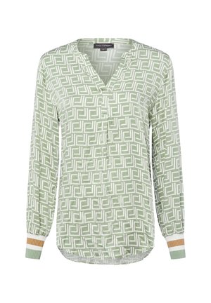 Langärmlige grüne Bluse mit weißem geometrischem Quadratmuster, V-Ausschnitt und gerippten Bündchen mit weißen und braunen Streifen.