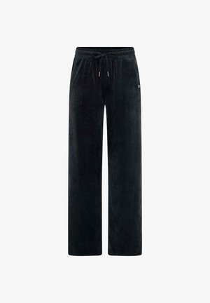 Pantalones de pana negros de corte holgado, con cintura elástica y un sutil relieve en la tela. Incluyen bolsillos laterales y un mínimo detalle de marca.
