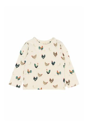 Majica z dolgimi rokavi iz kremaste tkanine, ki se ponaša z večkratno podobo piščanca v različnih barvah. Vključen je zapenjalni gumb na rami.