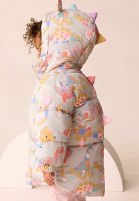 Padded hooded jacket in light grey with colorful animal and flower patterns. Features playful spikes on the hood and elastic cuffs.
