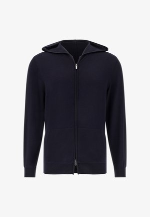 Námořnická modrá mikina na zip vyrobená z měkké látky, se zapínáním na celý zip, předními kapsami a pružnými manžetami. Hladká textura s minimalistickým designem.