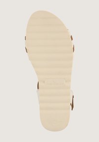 Weiße Sandalen mit einer strukturierten, beigen Gummisohle. Mit braunen Akzenten und verstellbaren Riemen. Größe 40.