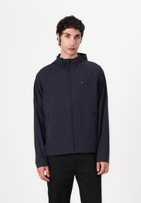 Tommy Hilfiger TECH HOODED JACKET - Chaqueta de entretiempo - desert sky
